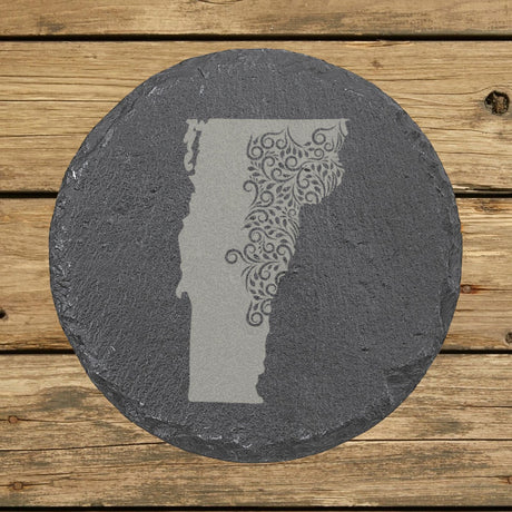 Vermont round slate coaster engraved with the state shape in ornate floral scrollwork