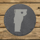 Vermont round slate coaster engraved with the state shape and a heart