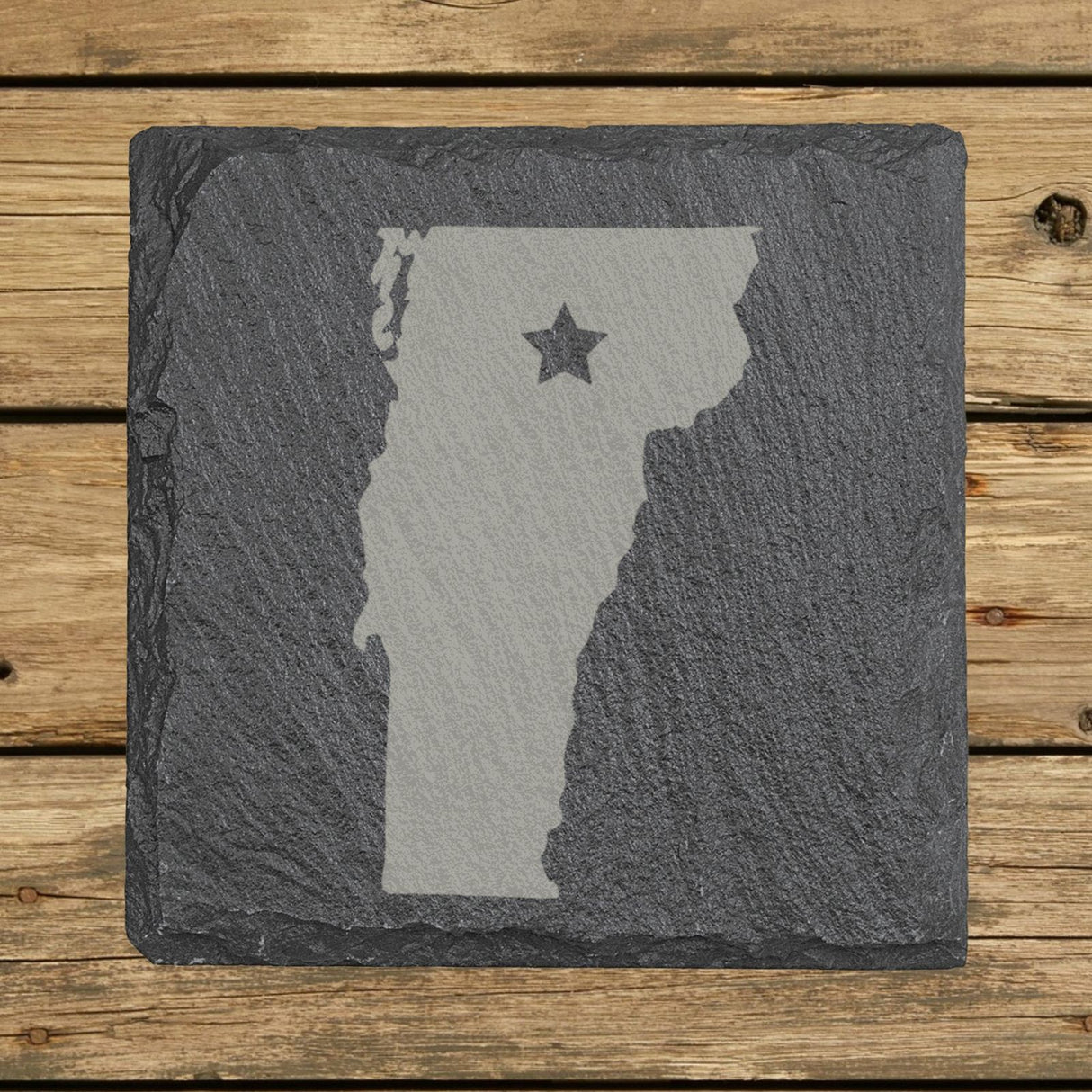 Vermont square slate coaster engraved with the state shape and a star