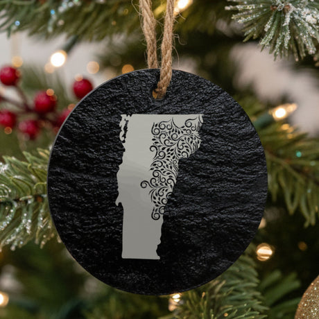 Vermont round slate Christmas ornament engraved with the state shape in ornate floral scrollwork