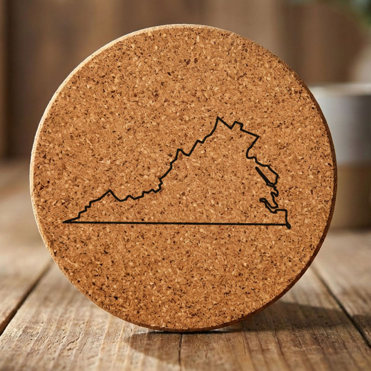Virginia round cork coaster engraved with a clean state outline