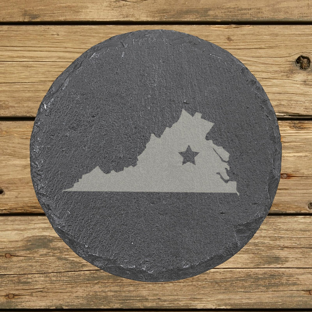 Virginia round slate coaster engraved with the state shape and a star