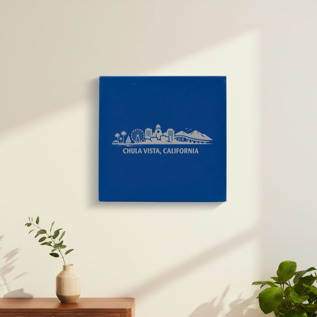 Blue leatherette wall sign engraved with the Chula Vista, California skyline, hanging on a wall