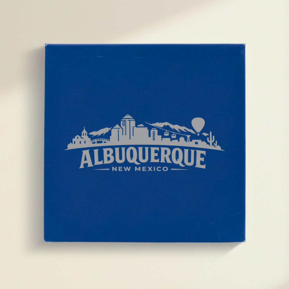 Close up of the Albuquerque, New Mexico skyline engraved on Blue leatherette
