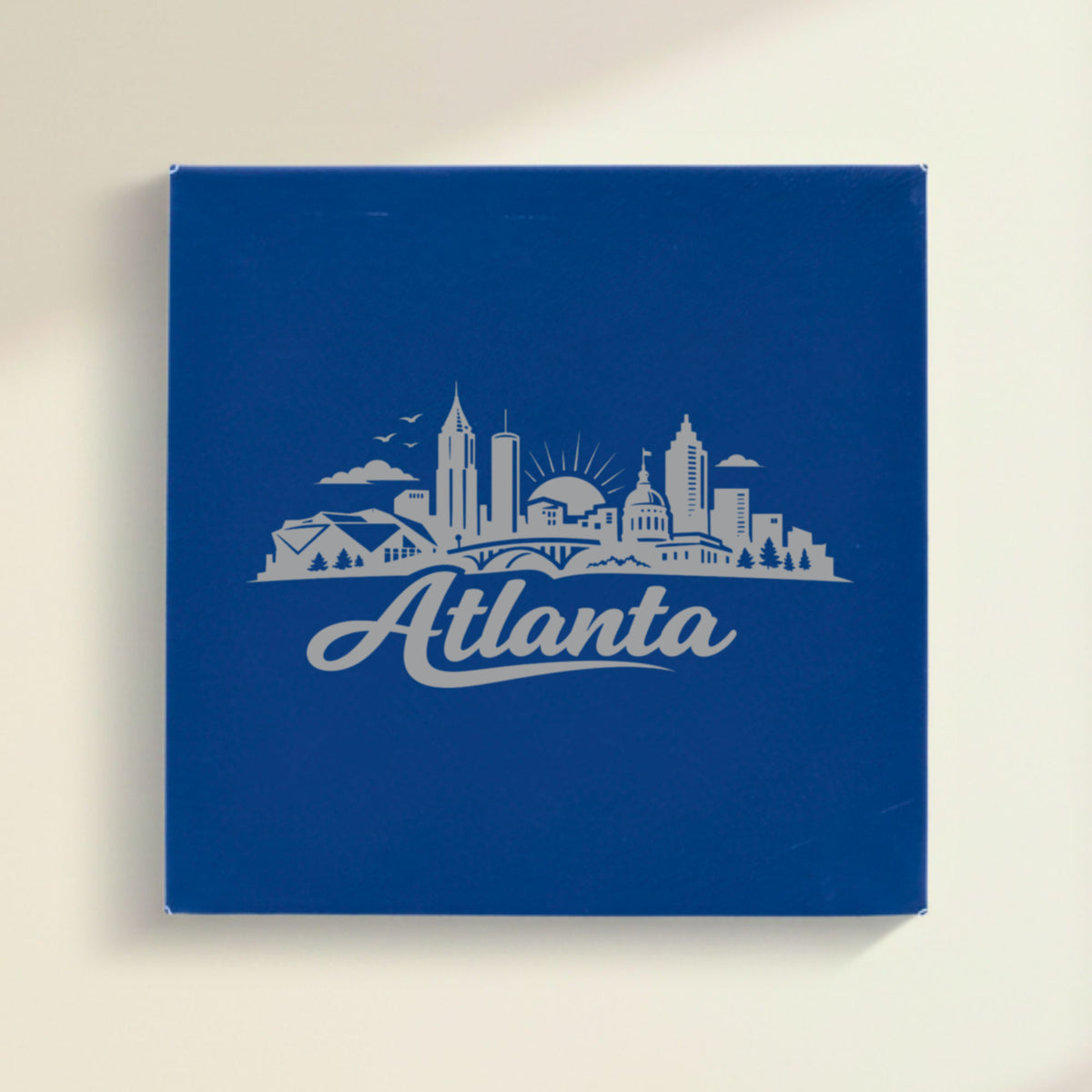 Close up of the Atlanta, Georgia skyline engraved on Blue leatherette