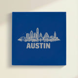 Close up of the Austin, Texas skyline engraved on Blue leatherette