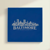 Close up of the Baltimore, Maryland skyline engraved on Blue leatherette