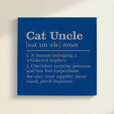 Close-up of the blue leatherette wall sign engraved with the Cat Uncle dictionary definition