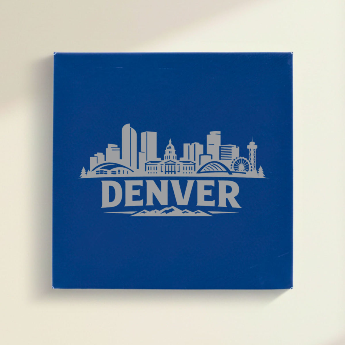 Close up of the Denver, Colorado skyline engraved on Blue leatherette