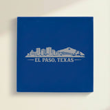 Close up of the El Paso, Texas skyline engraved on Blue leatherette