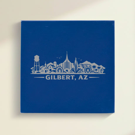 Close up of the Gilbert, Arizona skyline engraved on Blue leatherette