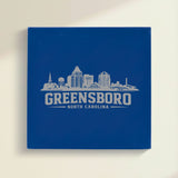 Close up of the Greensboro, North Carolina skyline engraved on Blue leatherette