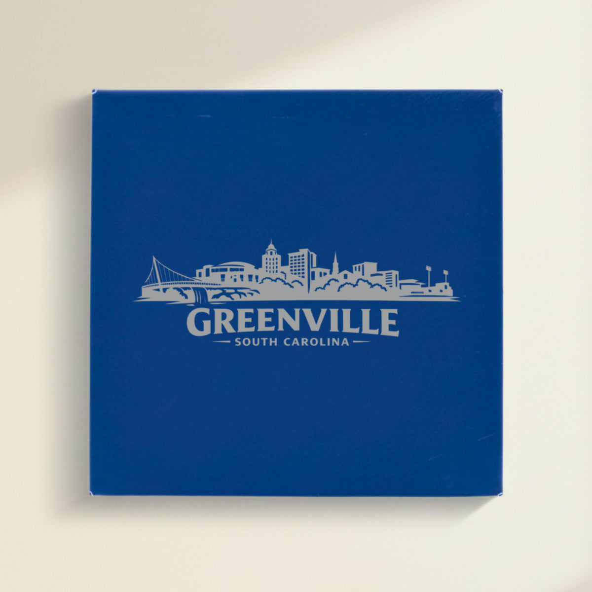 Close up of the Greenville, South Carolina skyline engraved on Blue leatherette