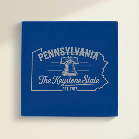 Close up of the Pennsylvania design engraved on Blue leatherette: the Liberty Bell, "The Keystone State", EST. 1787