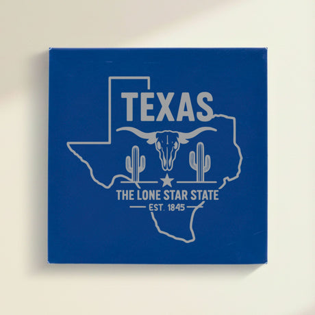 Close up of the Texas design engraved on Blue leatherette: a longhorn skull, cactus and a lone star, "The Lone Star State", EST. 1845