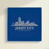 Close up of the Jersey City, New Jersey skyline engraved on Blue leatherette