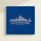 Close up of the Lexington, Kentucky skyline engraved on Blue leatherette