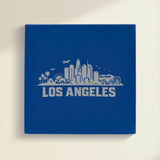 Close up of the Los Angeles, California skyline engraved on Blue leatherette