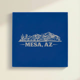 Close up of the Mesa, Arizona skyline engraved on Blue leatherette