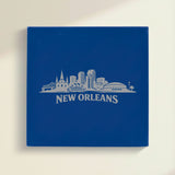 Close up of the New Orleans, Louisiana skyline engraved on Blue leatherette
