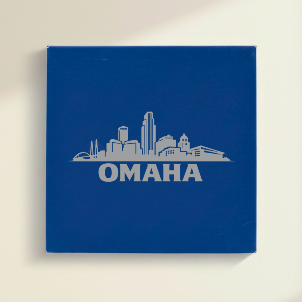 Close up of the Omaha, Nebraska skyline engraved on Blue leatherette