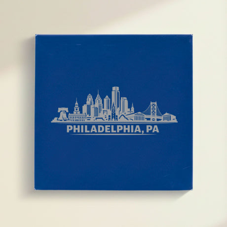 Close up of the Philadelphia, Pennsylvania skyline engraved on Blue leatherette