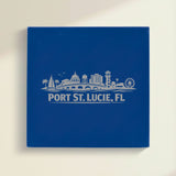 Close up of the Port St. Lucie, Florida skyline engraved on Blue leatherette