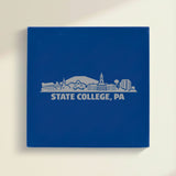 Close up of the State College, Pennsylvania skyline engraved on Blue leatherette