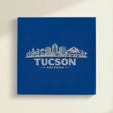 Close up of the Tucson, Arizona skyline engraved on Blue leatherette