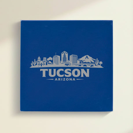 Close up of the Tucson, Arizona skyline engraved on Blue leatherette