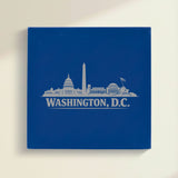 Close up of the Washington, DC skyline engraved on Blue leatherette