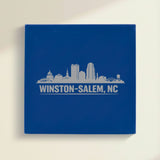 Close up of the Winston-Salem, North Carolina skyline engraved on Blue leatherette