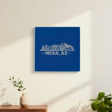 Blue leatherette wall sign engraved with the Mesa, Arizona skyline, hanging on a wall