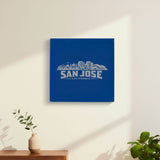 Blue leatherette wall sign engraved with the San Jose, California skyline, hanging on a wall