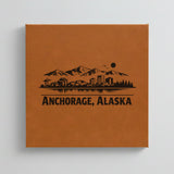 Close up of the Anchorage, Alaska skyline engraved on Brown leatherette