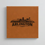 Close up of the Arlington, Texas skyline engraved on Brown leatherette