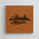 Close up of the Atlanta, Georgia skyline engraved on Brown leatherette