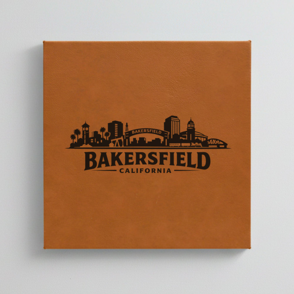 Close up of the Bakersfield, California skyline engraved on Brown leatherette