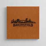 Close up of the Bakersfield, California skyline engraved on Brown leatherette