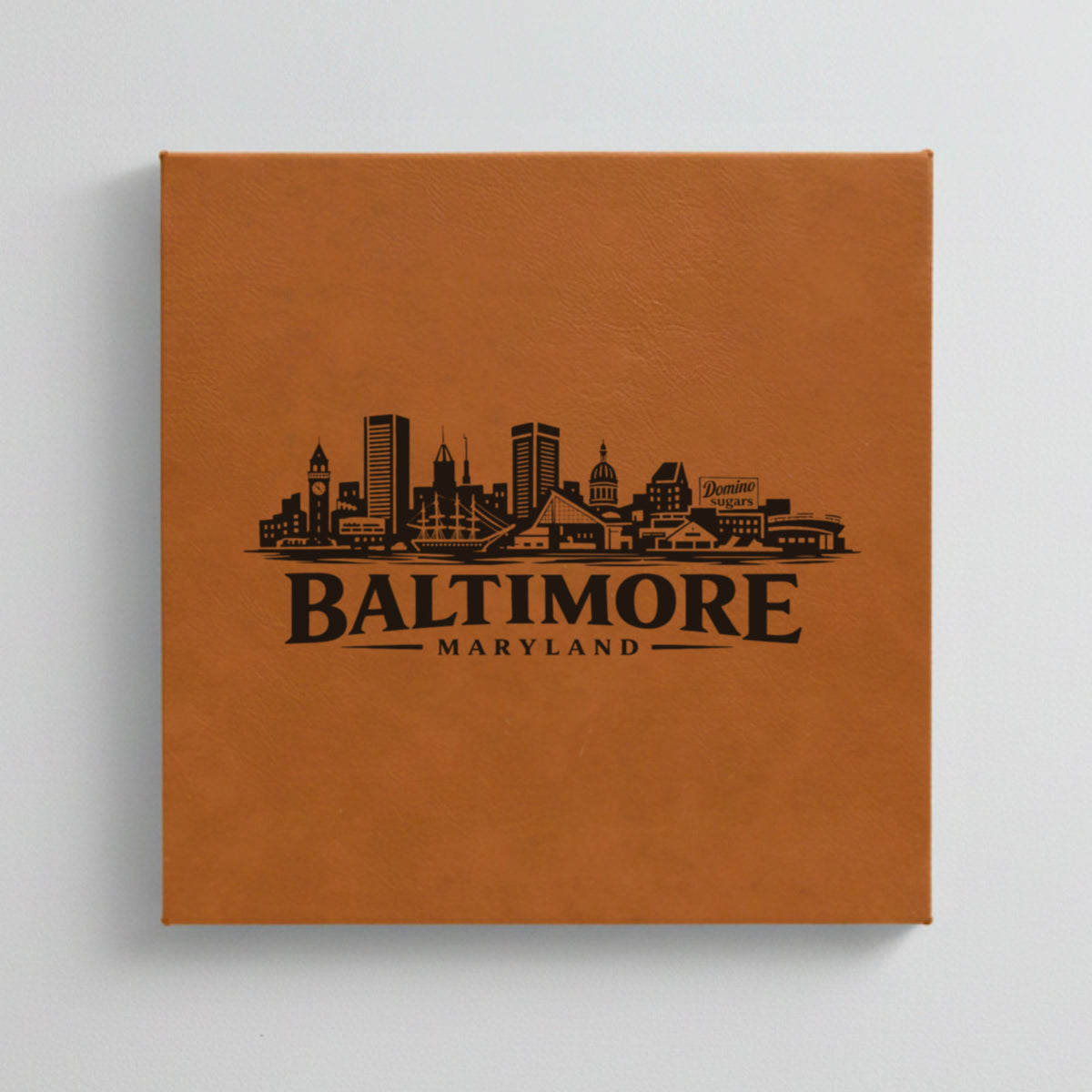 Close up of the Baltimore, Maryland skyline engraved on Brown leatherette
