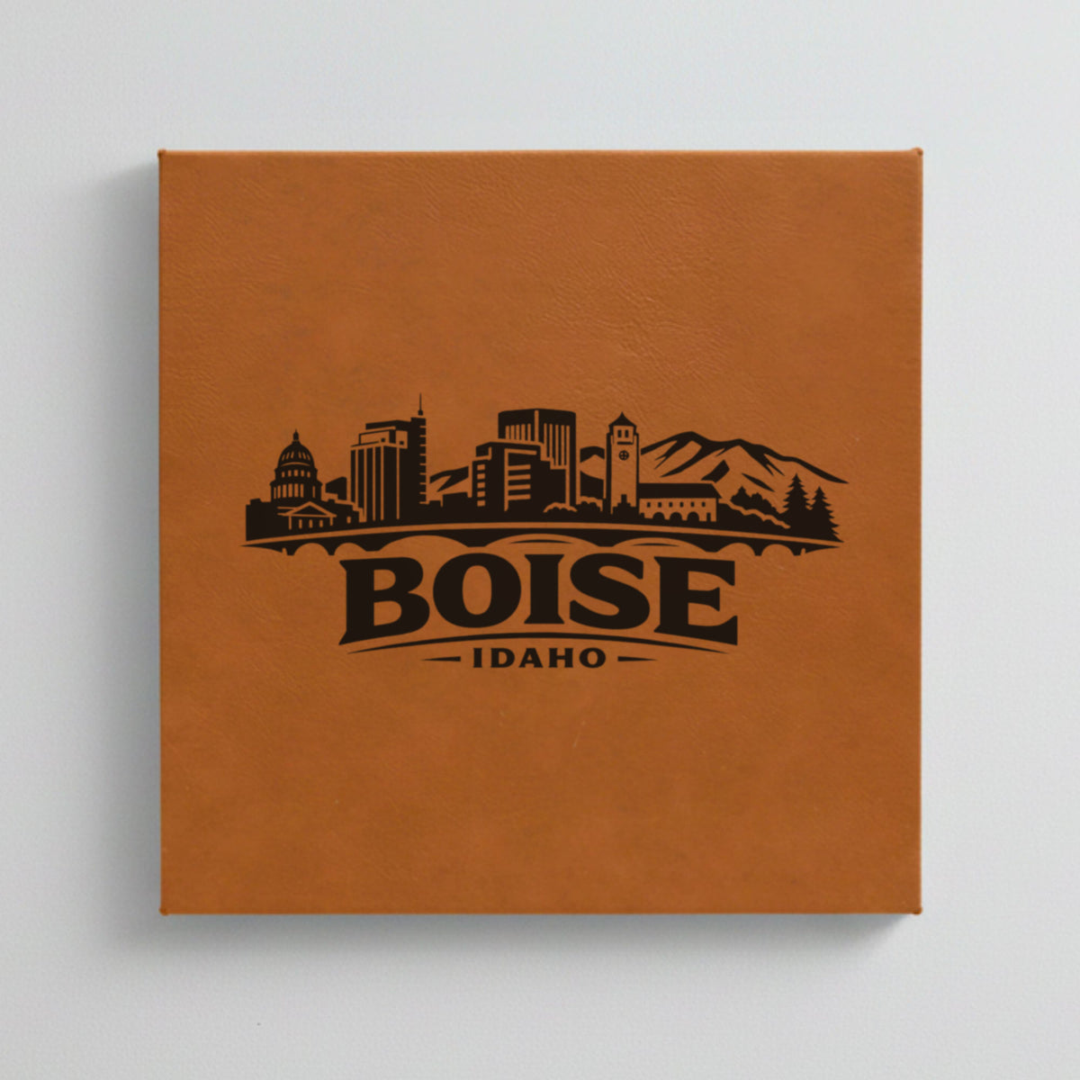 Close up of the Boise, Idaho skyline engraved on Brown leatherette