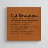 Close-up of the brown leatherette wall sign engraved with the Cat Grandma dictionary definition