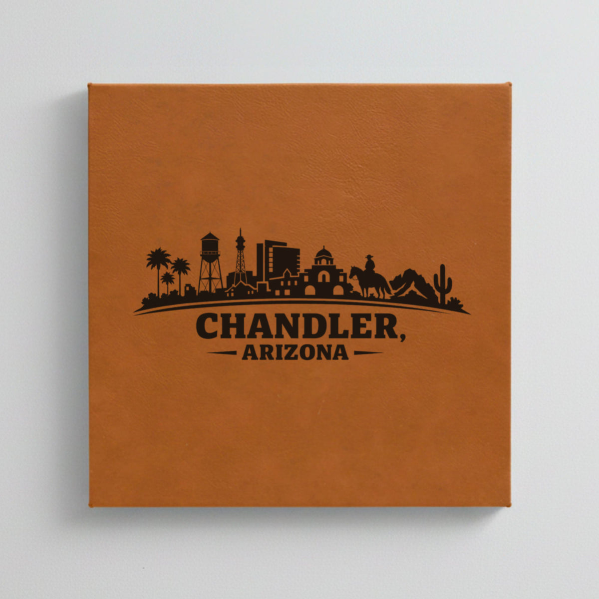 Close up of the Chandler, Arizona skyline engraved on Brown leatherette