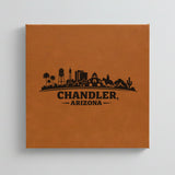 Close up of the Chandler, Arizona skyline engraved on Brown leatherette