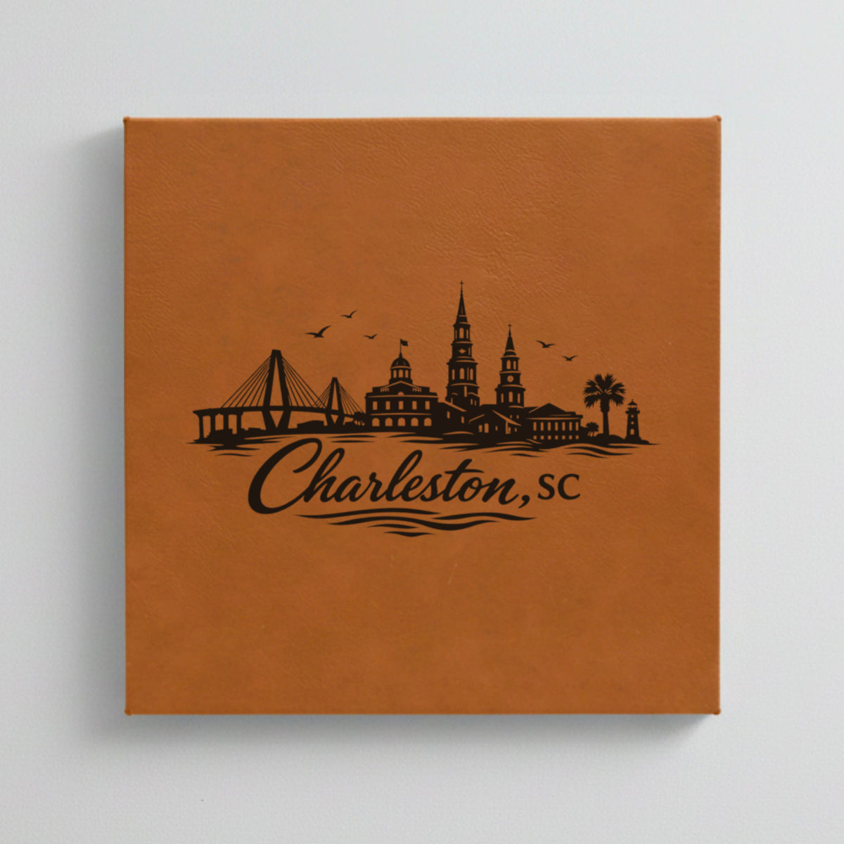 Close up of the Charleston, South Carolina skyline engraved on Brown leatherette