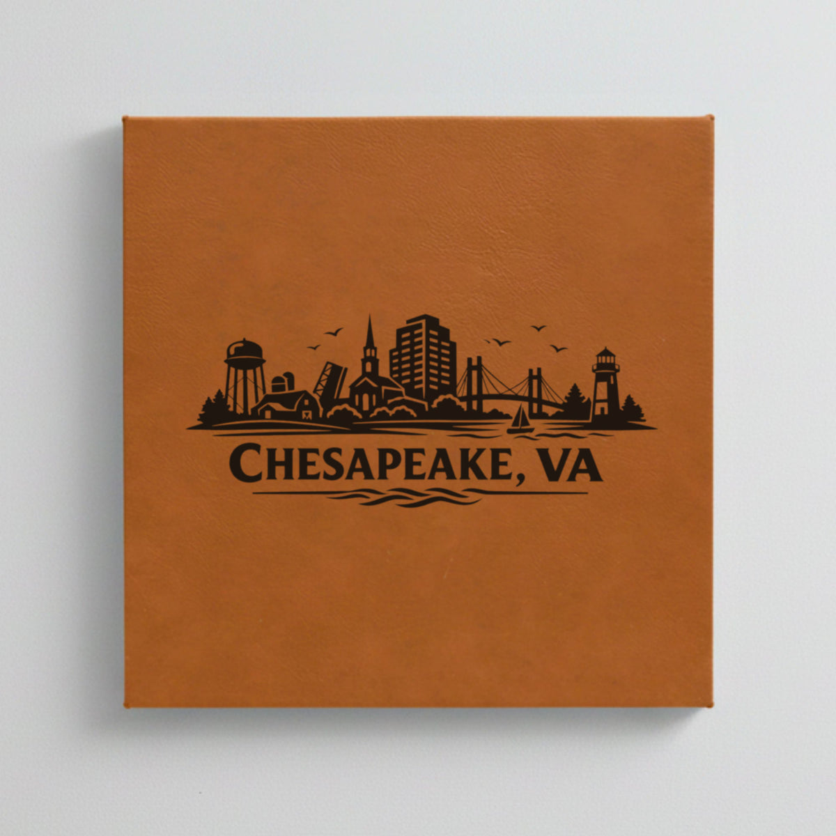 Close up of the Chesapeake, Virginia skyline engraved on Brown leatherette