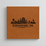 Close up of the Chesapeake, Virginia skyline engraved on Brown leatherette