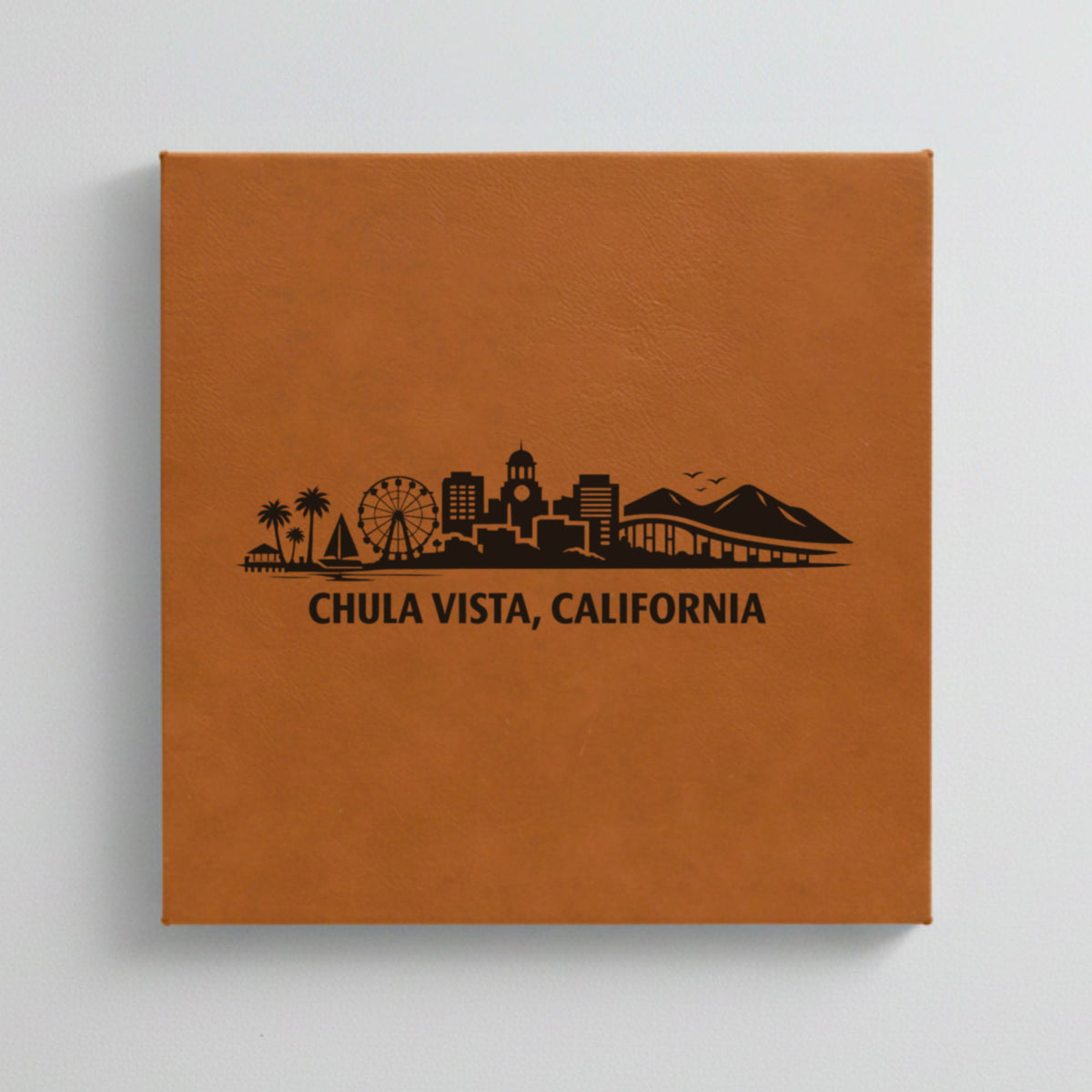 Close up of the Chula Vista, California skyline engraved on Brown leatherette