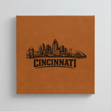 Close up of the Cincinnati, Ohio skyline engraved on Brown leatherette
