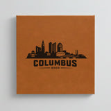 Close up of the Columbus, Ohio skyline engraved on Brown leatherette